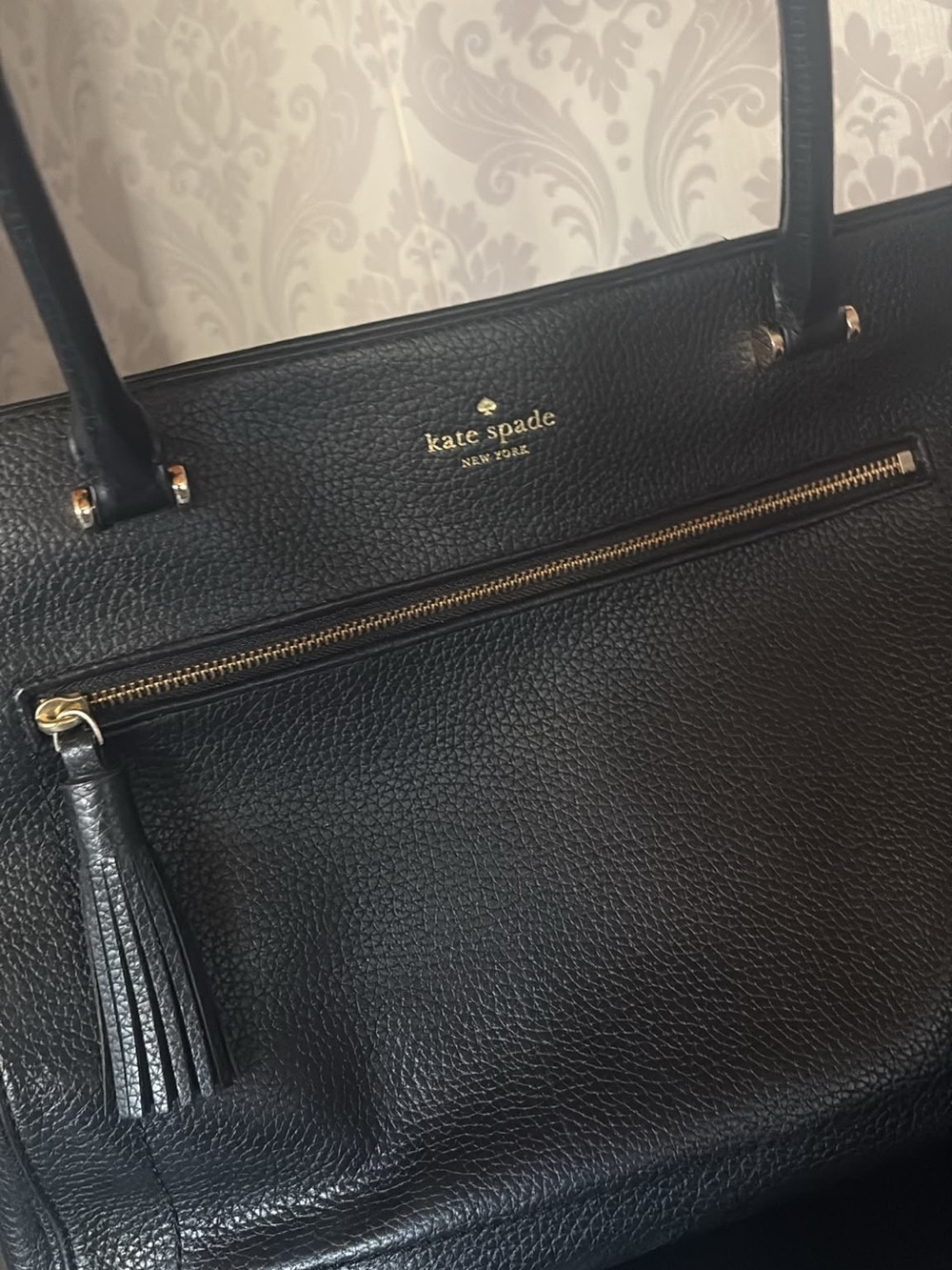kate spade black pebbled leather tote with tassel and front zipper